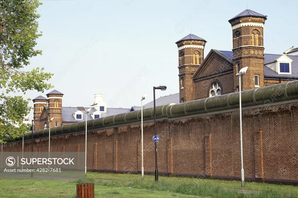 England, London, Hammersmith. The walled exterior of Wormwood Scrubs prison in London.