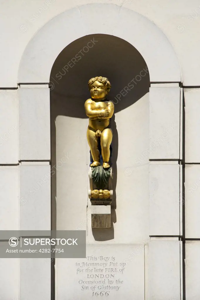 England, London, The City of London. The Golden Boy of Pye Corner, a small monument located on the corner of Giltspur Street and Cock Lane in Smithfield, London.