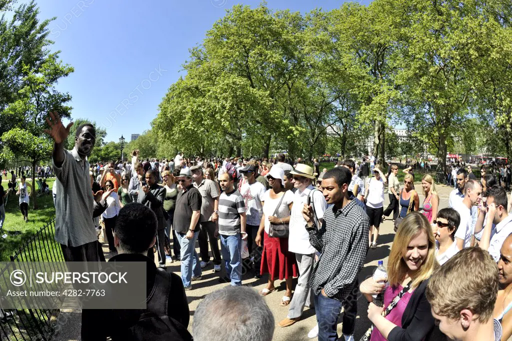 England, London, Hyde Park. A crowd of people listening to a speaker at Speakers' corner in Hyde Park.
