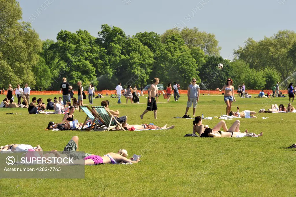 England, London, Hyde Park. Crowds of people relaxing in Hyde Park on a sunny summers day.