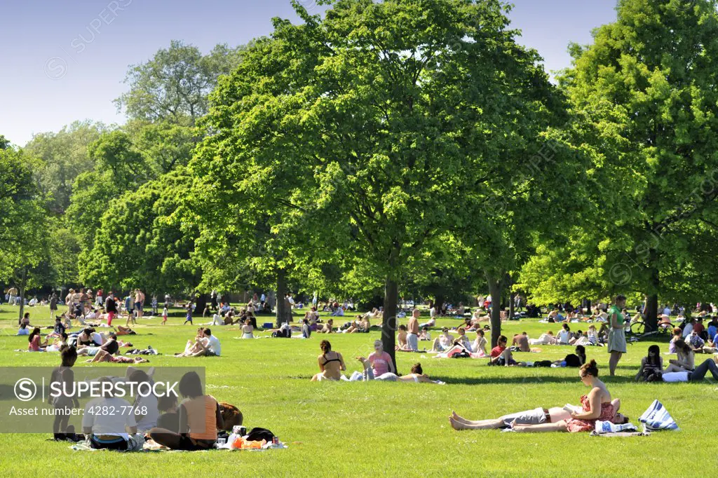England, London, Hyde Park. Crowds of people relaxing in Hyde Park on a sunny summers day.