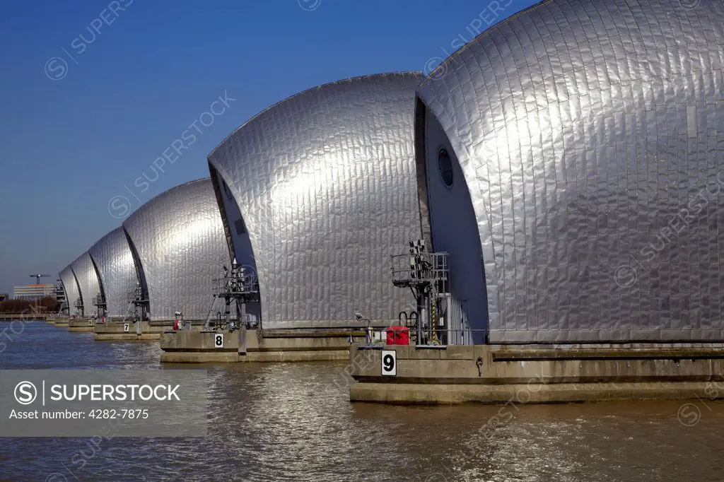 England, London, Woolwich. The Thames Barrier, the world's second largest movable flood barrier, on the River Thames.