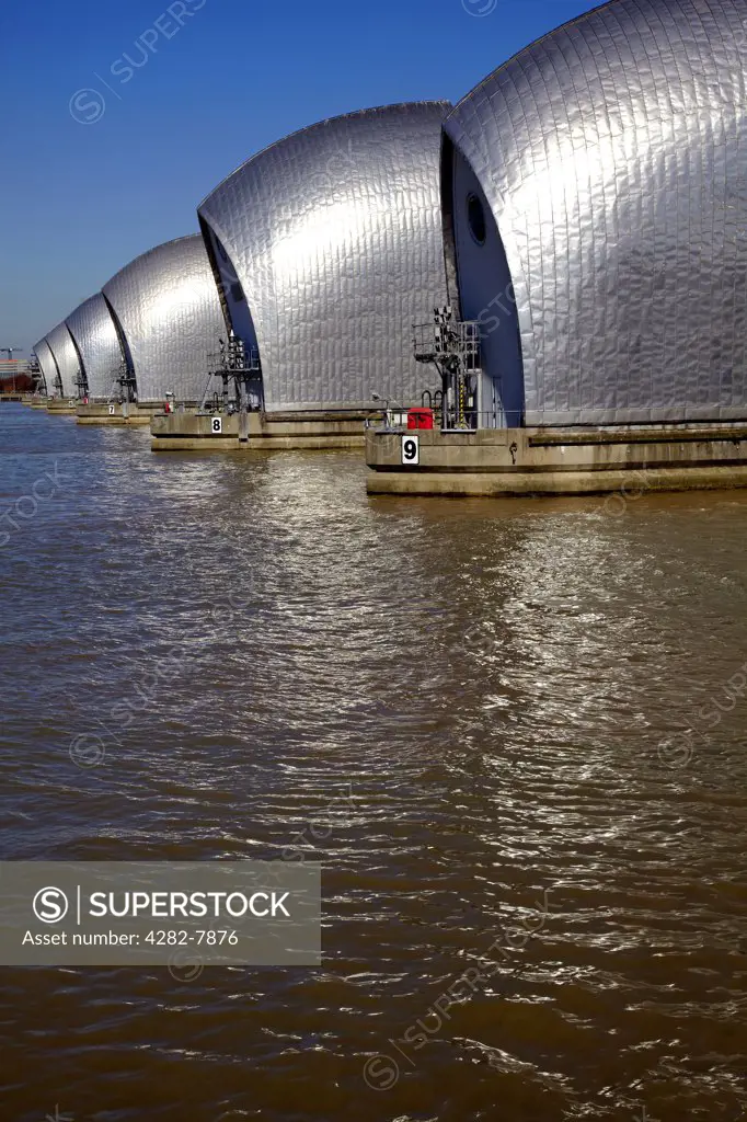 England, London, Woolwich. The Thames Barrier, the world's second largest movable flood barrier, on the River Thames.