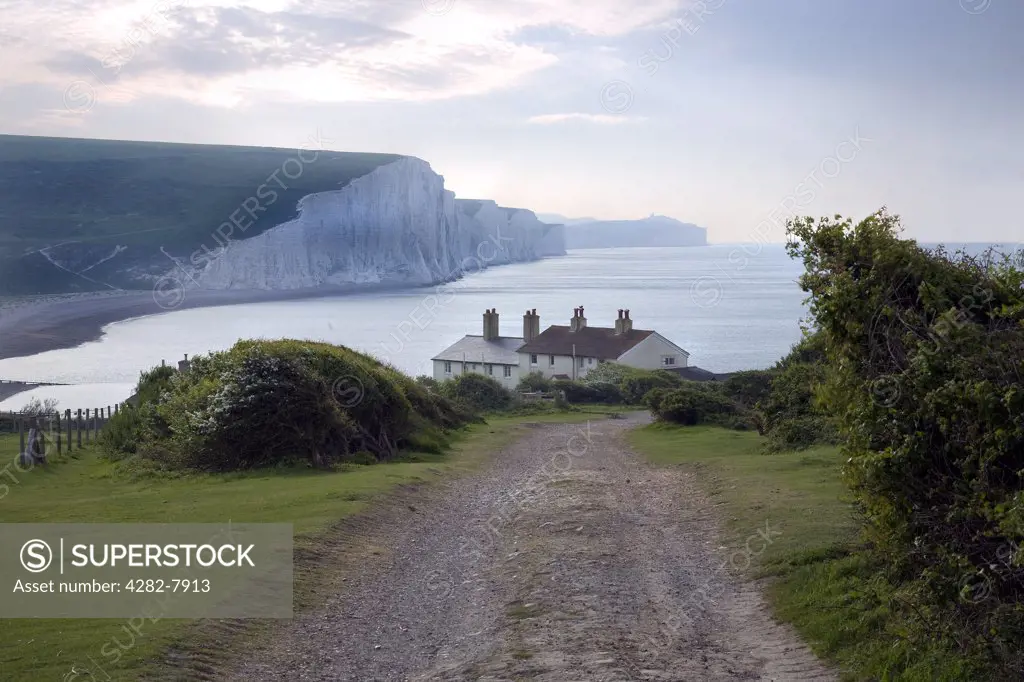 England, East Sussex, Cuckmere Haven. Looking east from Cuckmere Haven towards the chalk cliffs of the Seven Sisters.