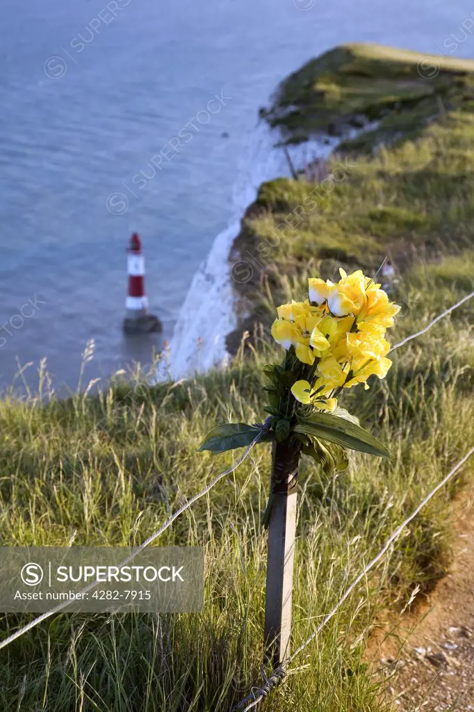 England, East Sussex, Beachy Head. A bunch of flowers tied in rememberance of a loved one at Beachy Head cliff.