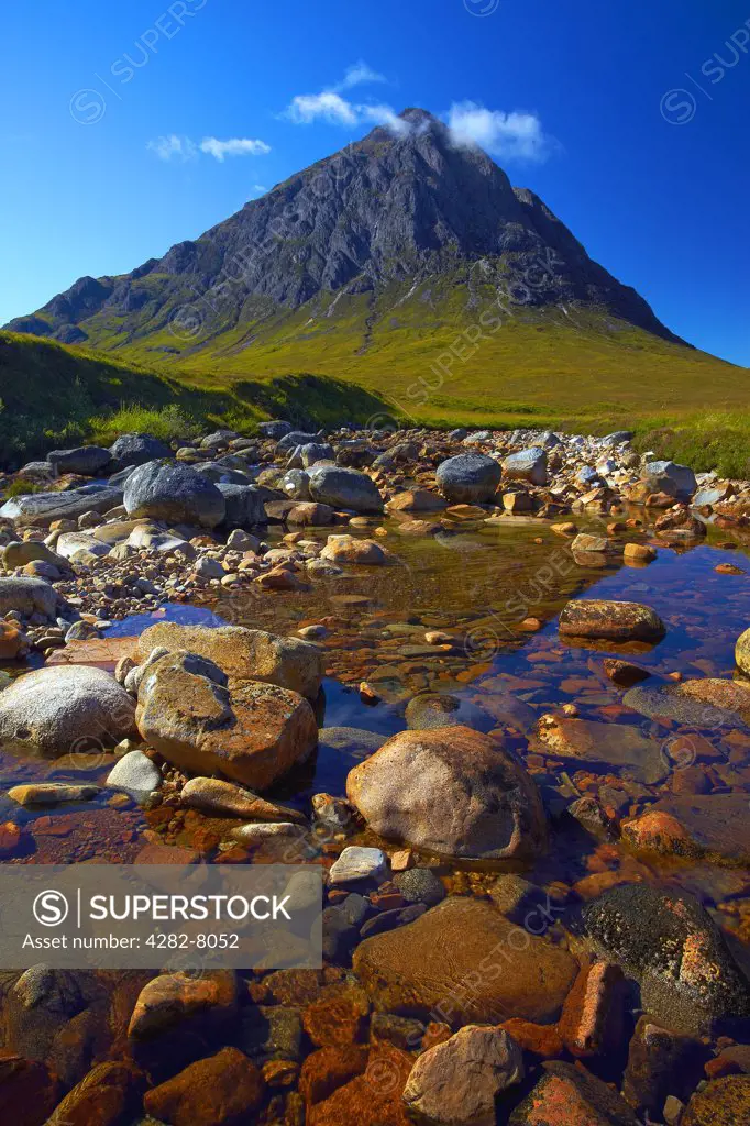 Scotland, Highland, Rannoch Moor. Buachaille Etive Màö§r, a mountain standing guard at the entrance to Glen Etive. It's almost perfect pyramid shape has made it one of the most popular and recognisable mountains in Scotland.
