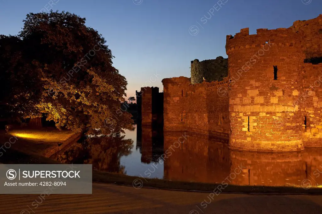 Wales, Anglesey, Beaumaris. Beaumaris Castle and moat at dusk. The castle was built in 1295 as one of Edward l's 'iron ring' of castles but was never completed due to lack of funds and supplies. Many regard it as the finest Edwardian castle in Wales.