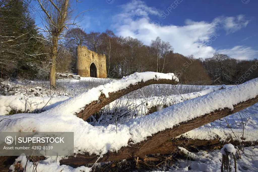 England, West Yorkshire, Leeds. Snow covering the ground around the castle in Roundhay Park, one of the biggest city parks in Europe. The castle is a 19th century folly built by George Nettleton.