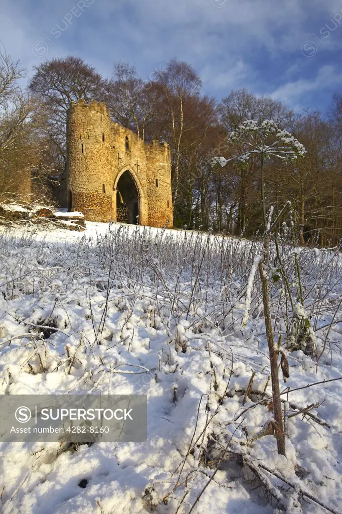 England, West Yorkshire, Leeds. Snow covering the ground around the castle in Roundhay Park, one of the biggest city parks in Europe. The castle is a 19th century folly built by George Nettleton.