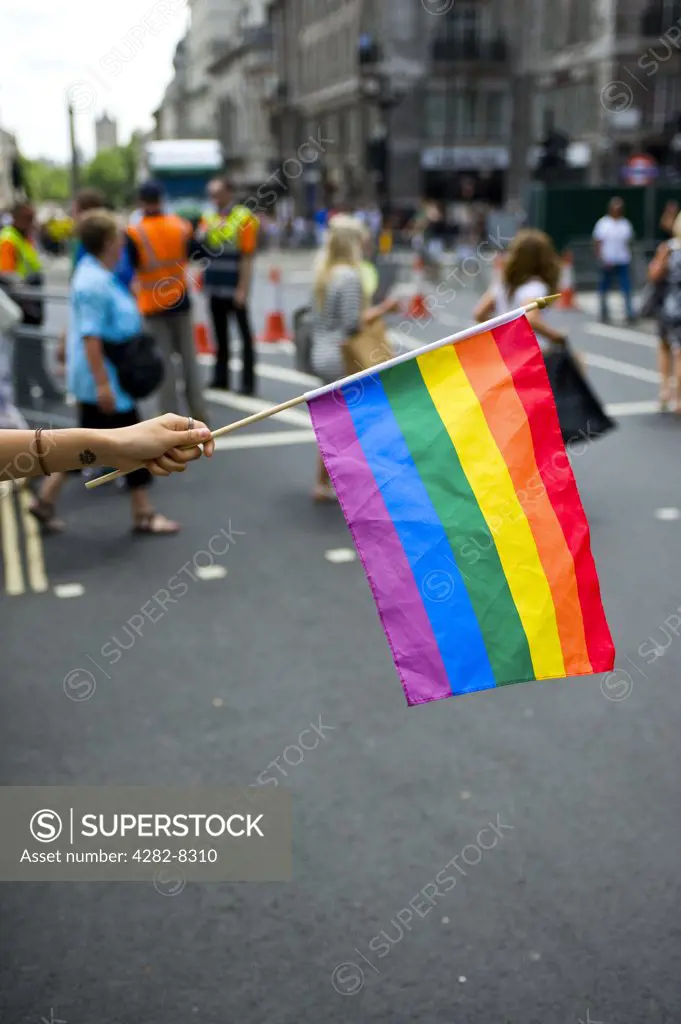 England, London. A Rainbow flag held out at the annual Pride London celebrations.