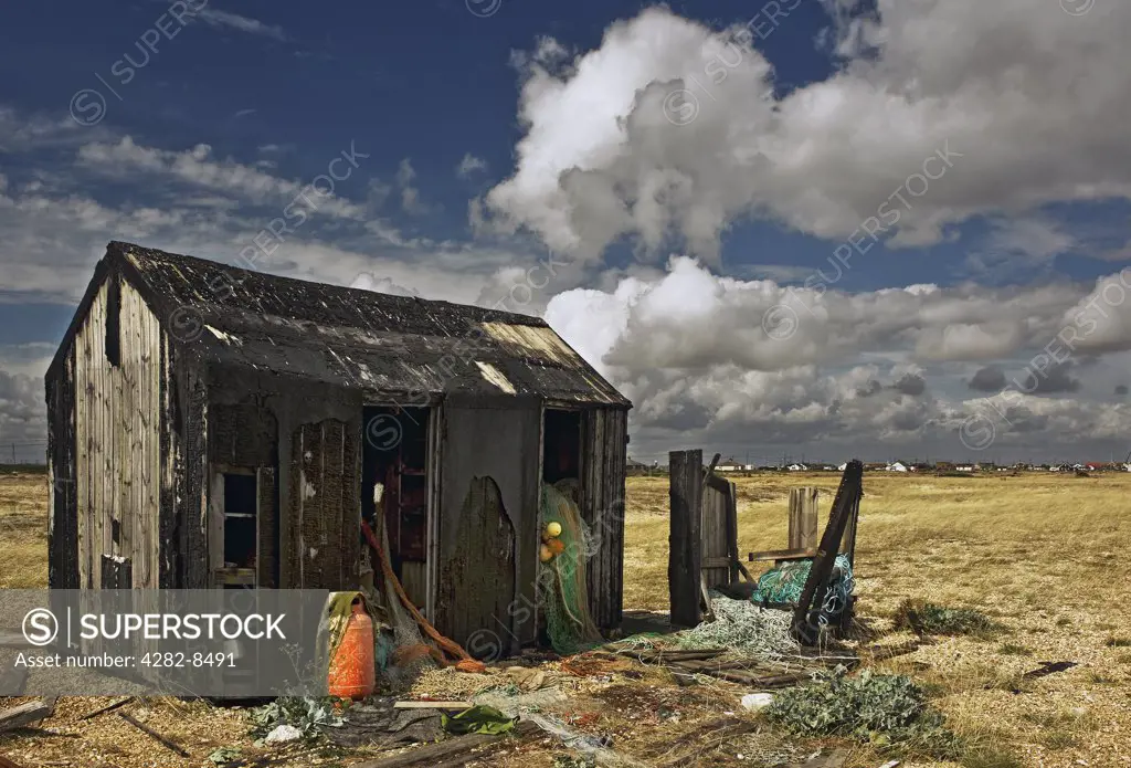 England, Kent, Dungeness. An abandoned derelict wooden hut on the shingle at Dungeness.
