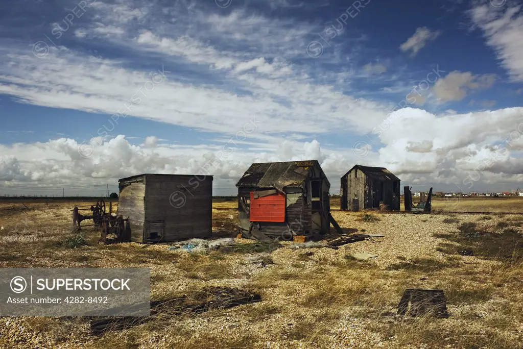 England, Kent, Dungeness. Abandoned derelict wooden huts on the shingle at Dungeness.