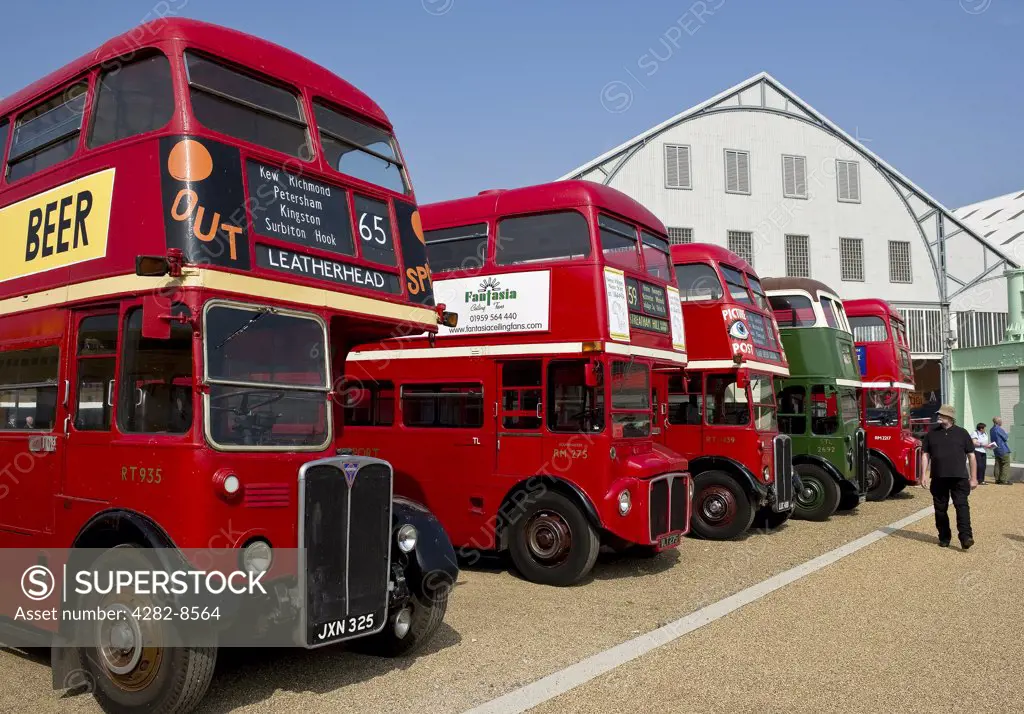 England, Kent, Chatham. A line of historic double decker buses on display at the Chatham Historic Dockyard.