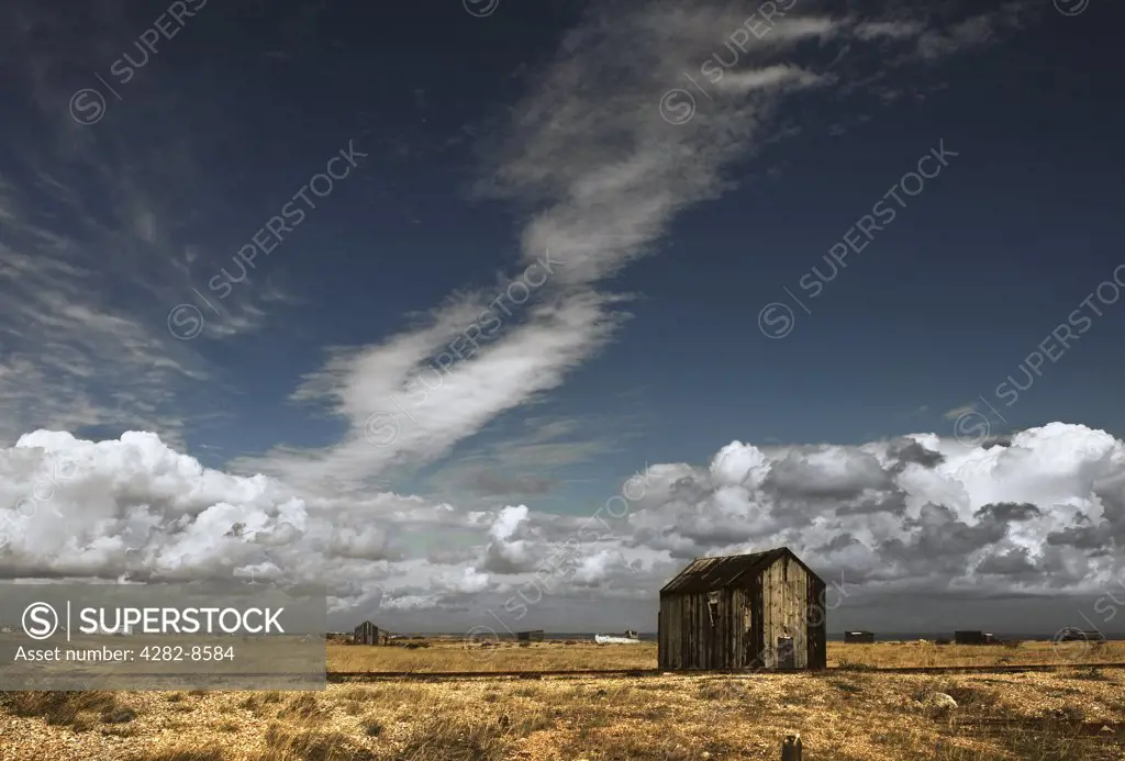 England, Kent, Dungeness. An abandoned fishermans wooden hut on the shingle beach at Dungeness.