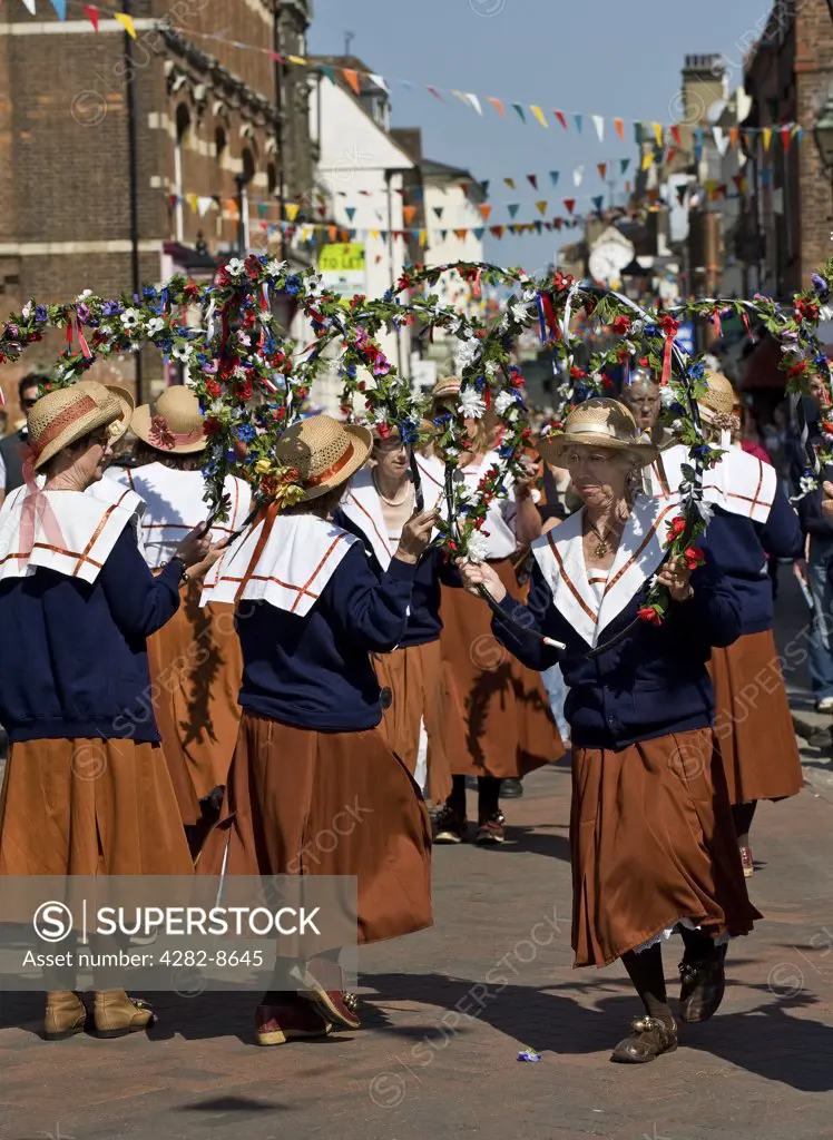 England, Kent, Rochester. Copperfield Clog Womens' Northwest Morris Dancers performing at the annual Sweeps Festival in Rochester.
