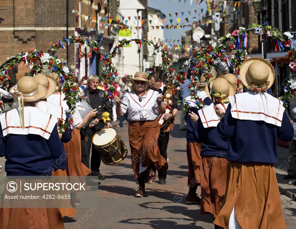 England, Kent, Rochester. Copperfield Clog Womens' Northwest Morris Dancers performing at the annual Sweeps Festival in Rochester.