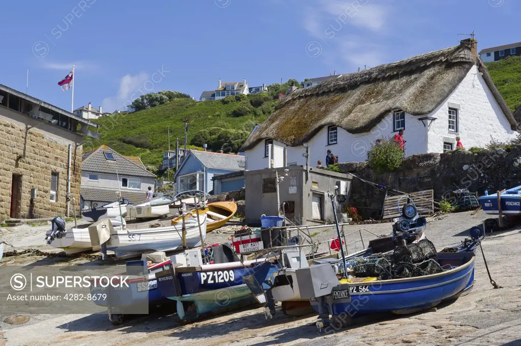 England, Cornwall, Sennen Cove. Fishing boats drawn up on the slipway at Sennen Cove in Cornwall.