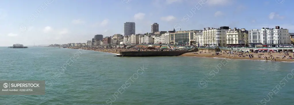 England, City of Brighton and Hove, Brighton. Panoramic view along the busy seafront at Brighton.