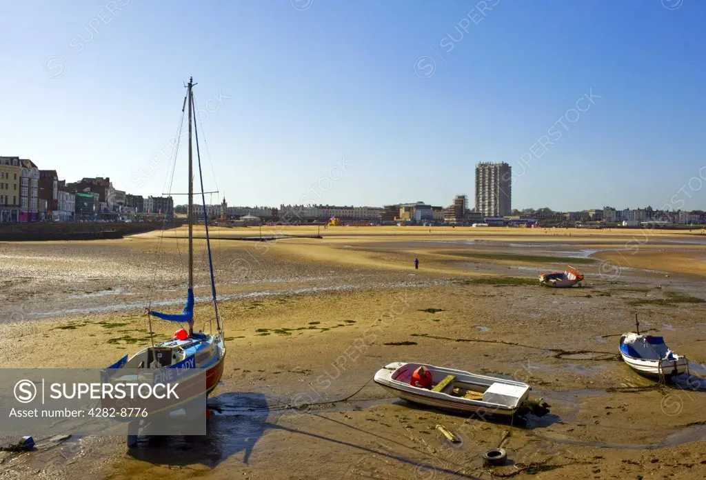 England, Kent, Margate. Boats on Margate Sands at low tide.