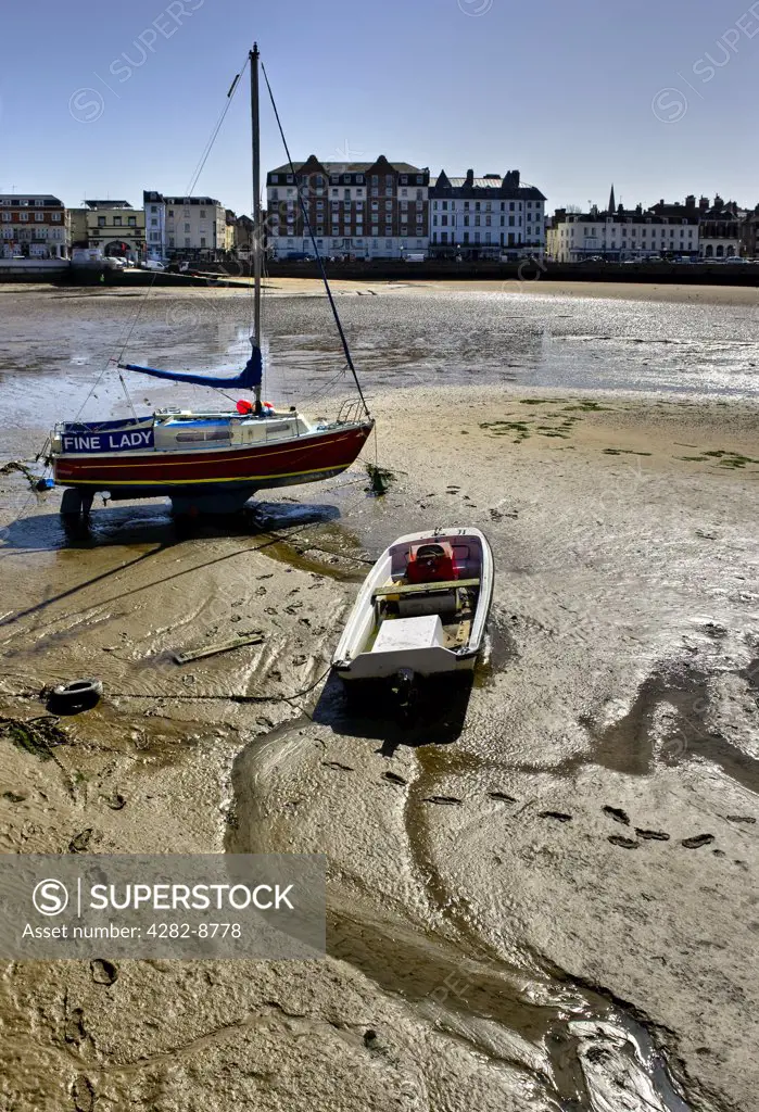 England, Kent, Margate. Boats on Margate Sands at low tide.