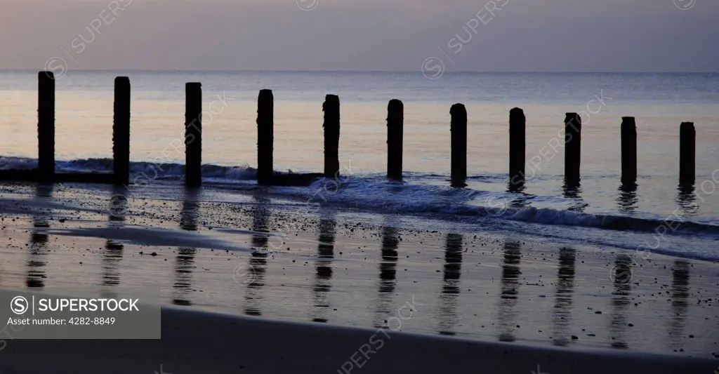 England, Essex, Clacton-on-Sea. Waves rolling gently on to the beach at Holland Haven Country Park near Clacton-on-Sea.