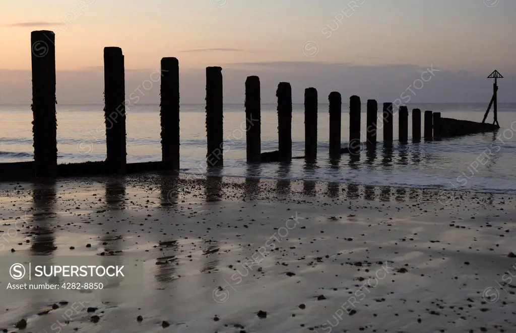 England, Essex, Clacton-on-Sea. A groyne leading from the beach out to sea at Holland Haven Country Park near Clacton-on-Sea.