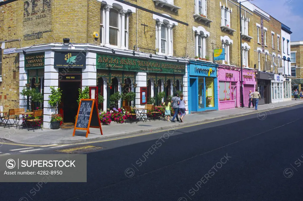 England, London, Stoke Newington. Shops and restaurants along Church Street in Stoke Newington.
