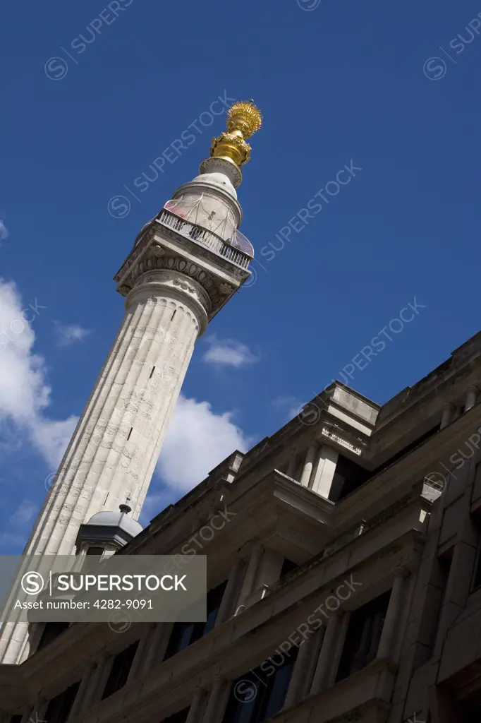 England, London, City of London. The newly restored Monument in the City of London. The Monument was built between 1671 and 1677 to commemorate the Great Fire of London and to celebrate the rebuilding of the City.