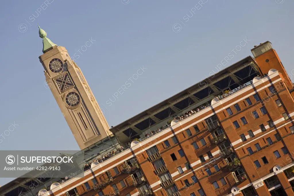 England, London, South Bank. The OXO Tower on the South Bank of the River Thames. The building contains arts and craft shops as well as residential apartments and a famous restaurant on the 8th floor.