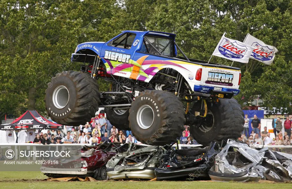 England, Warwickshire, Coventry. The world's no. 1 Monster Truck 'Bigfoot' performing in a car crushing challenge at the Stoneleigh Park Country Festival 2009.