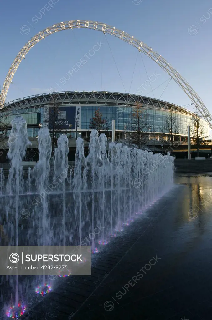 England, London, Wembley. Fountain display and the new iconic Wembley Stadium in London.