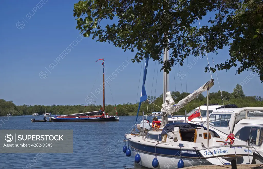 England, Norfolk, Ranworth . Boats moored at Ranworth Staithe fronting Malthouse Broad in the Norfolk Broads.