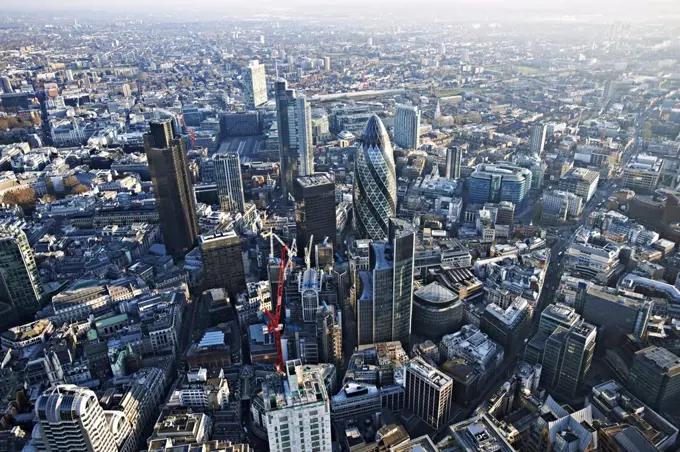 Aerial view of the city of London showing the Gherkin and Lloyds of London.