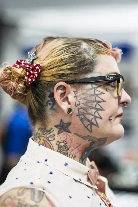 A profile view of female tattooist Julia Seizure at the Cornwall Tattoo Convention.