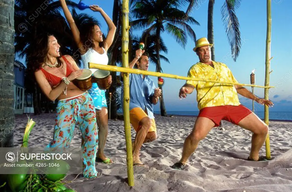 Vacationers have fun doing the limbo.