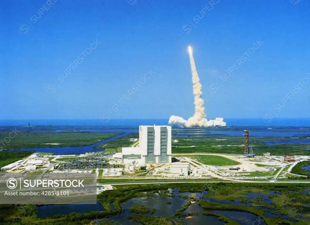 Space Shuttle lifting off from Kennedy Space Center.