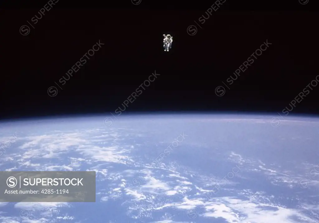 Astronaut floating in space. Astronaut. Capt. Bruce McCandless in the untethered Manned Maneuvering Unit (MMU).