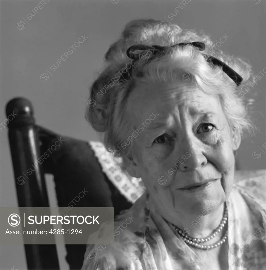 Portrait of an elderly woman looking worried.