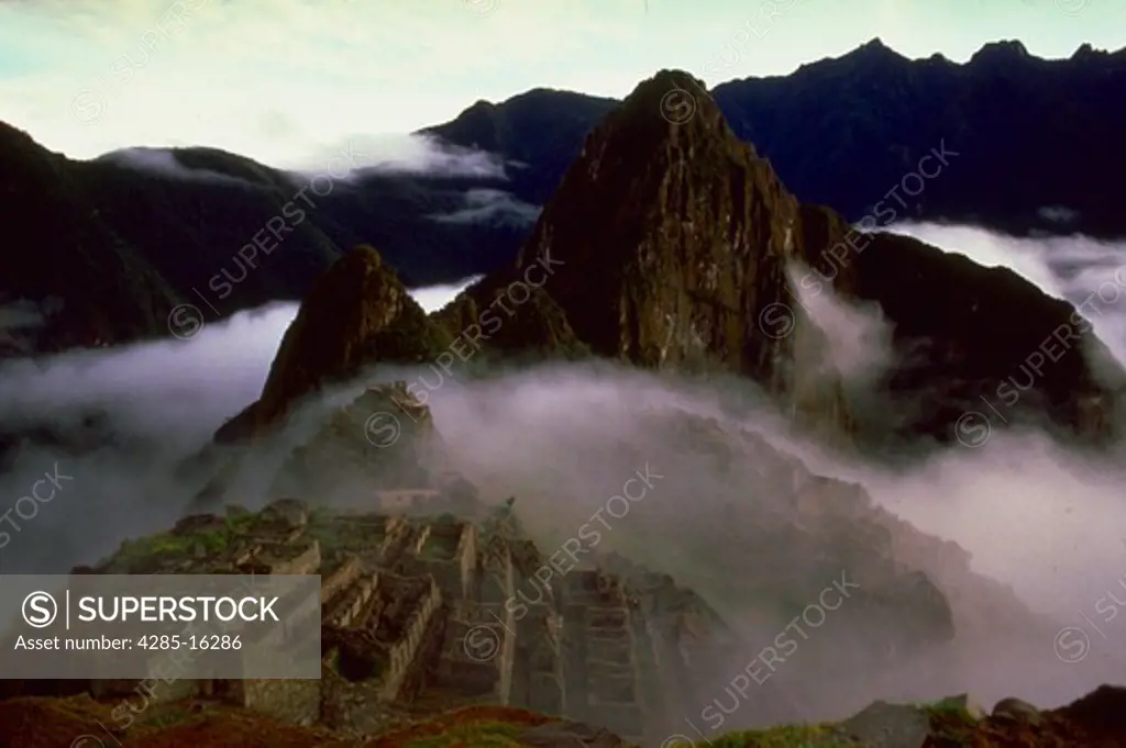 Machu Picchu  The incredible Inca site sitting in a saddle of the Andes Mountains.