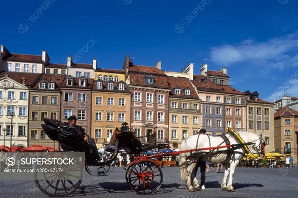 Horse and Carriage and Historical Burghers' Housing in old town square, Warsaw, Poland