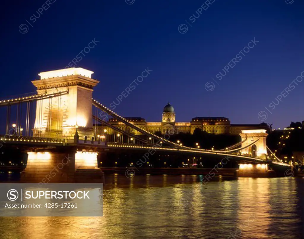 Chain Bridge and Danube River at night with the Royal Palace in the background, Budapest, Hungary