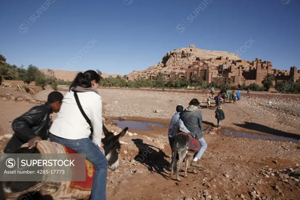 Africa, North Africa, Morocco, Atlas Region, Ouarzazate, Ait Benhaddou, Kasbah, Tourists Riding Donkeys