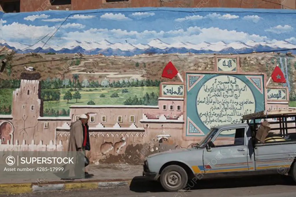 Africa, North Africa, Morocco, Atlas Mountains, Dades Valley, Boumalne Town, Painted Wall, Men