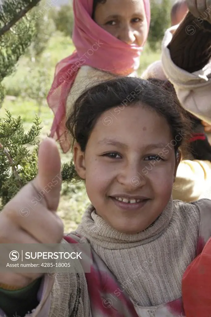 Africa, North Africa, Morocco, Atlas Mountains, Ziz Valley, Berber Girl in Countryside, Smiling