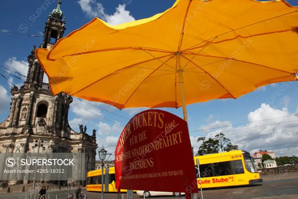 Germany, Saxony, Dresden, Schlossplatz, Castle Square, Hofkirche, Kathedrale St. Trinitatis, St. Trinity Cathedral, Tram, Yellow Umbrella