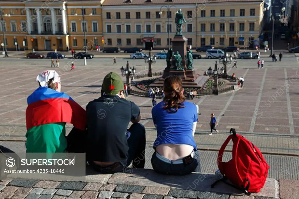 Finland, Helsinki, Helsingfors, Senate Square, Tourists Sitting on the Steps of The Cathedral