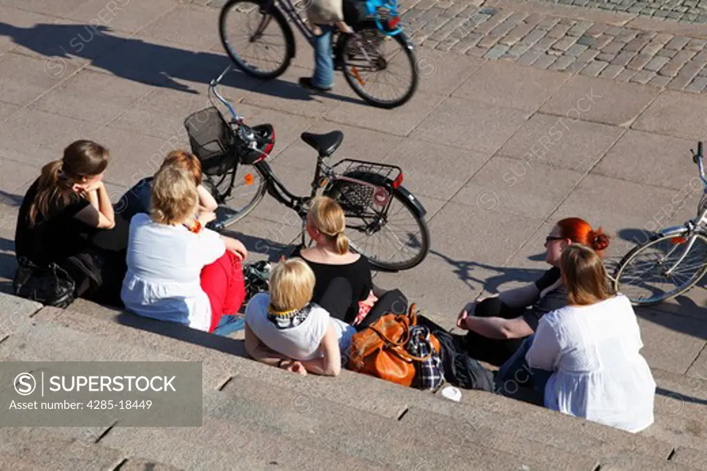 Finland, Helsinki, Helsingfors, Senate Square, Tourists Resting on the Steps of The Cathedral