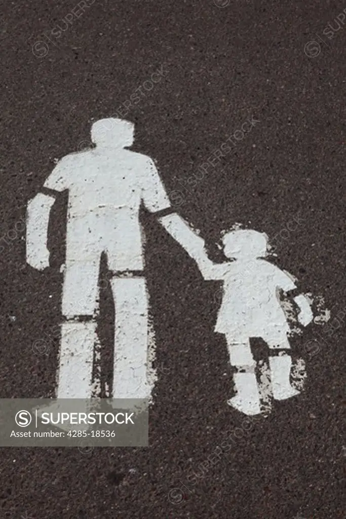Finland, Helsinki, Helsingfors, Man And Child Walking Sign Painted on Road Surface