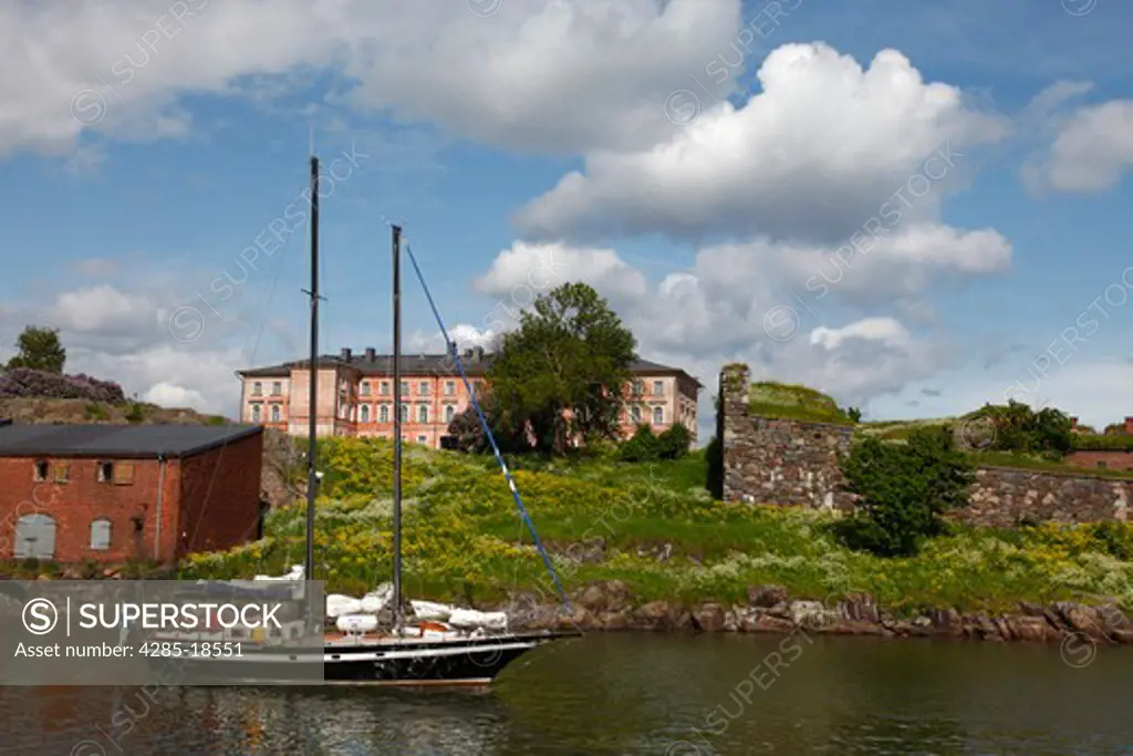 Finland, Helsinki, Helsingfors, Suomenlinna Island, Harbour, Yacht, Historic Buildings and Fortress Walls in the Background