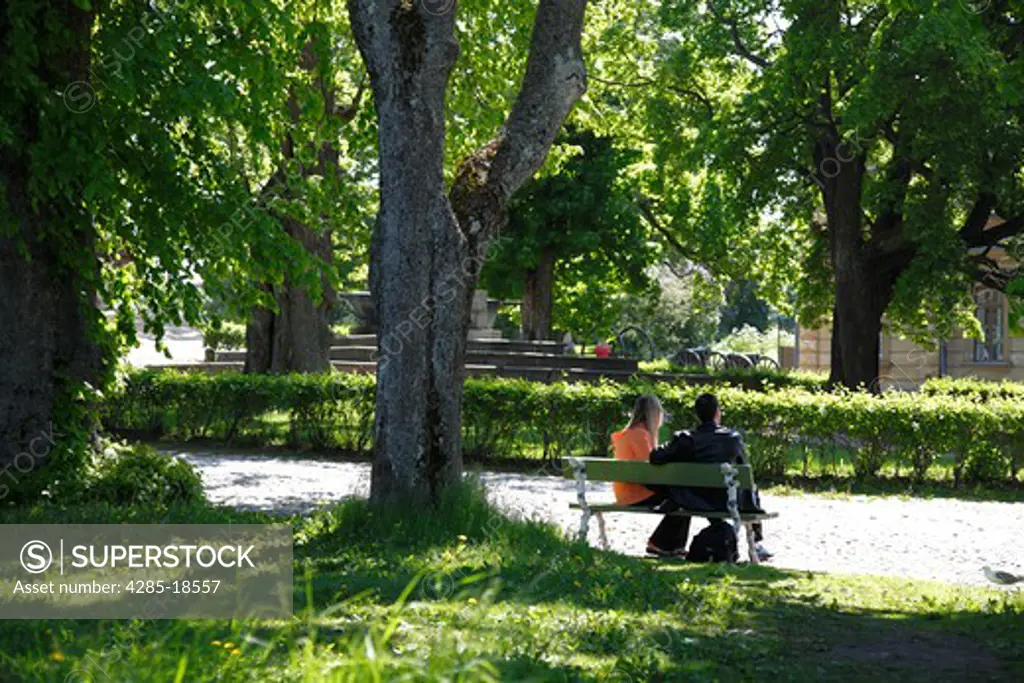 Finland, Helsinki, Helsingfors, Suomenlinna Island, The Great Courtyard, Couple Sitting on Bench